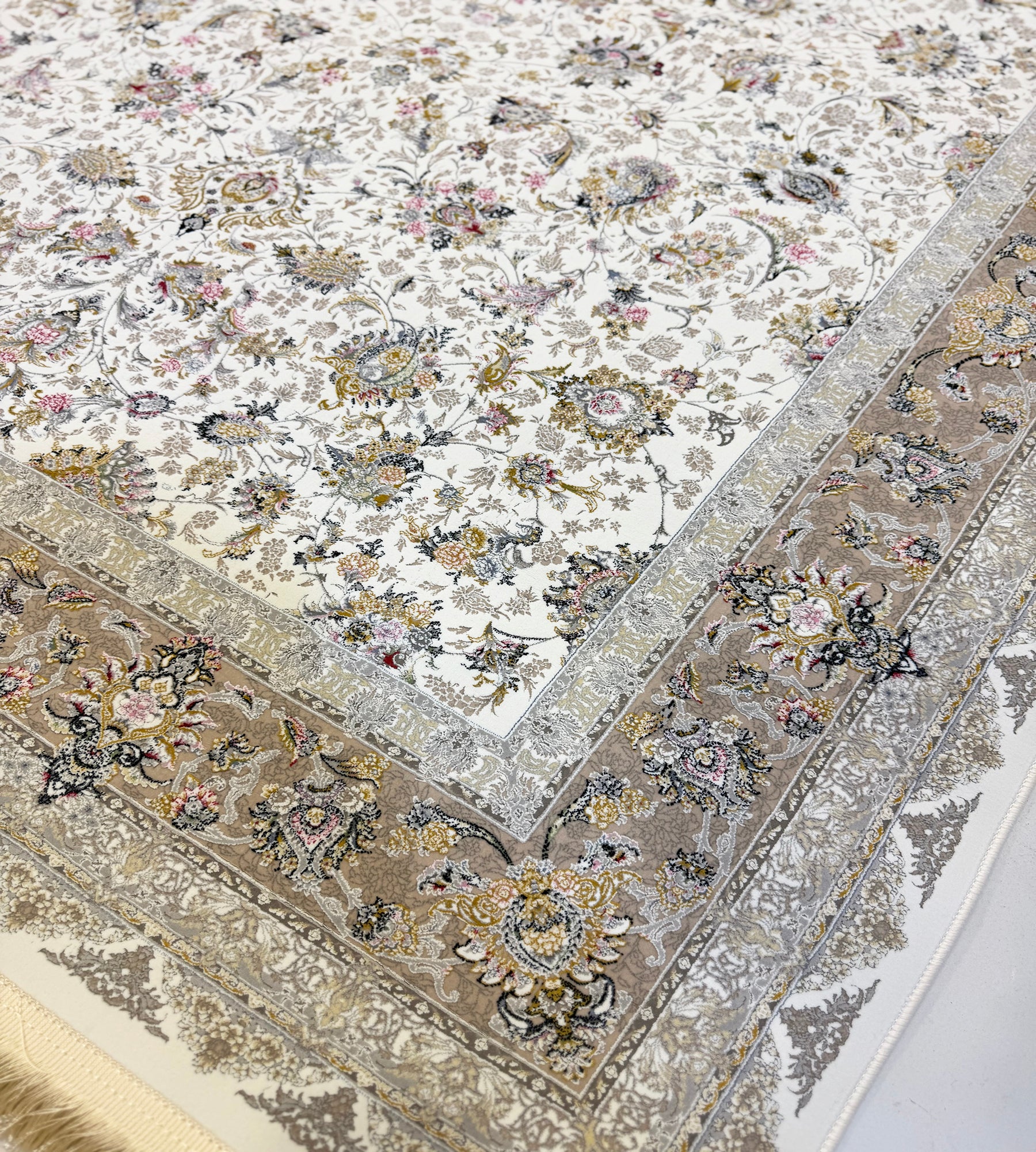 Close-up of a floral patterned rug with intricate designs.