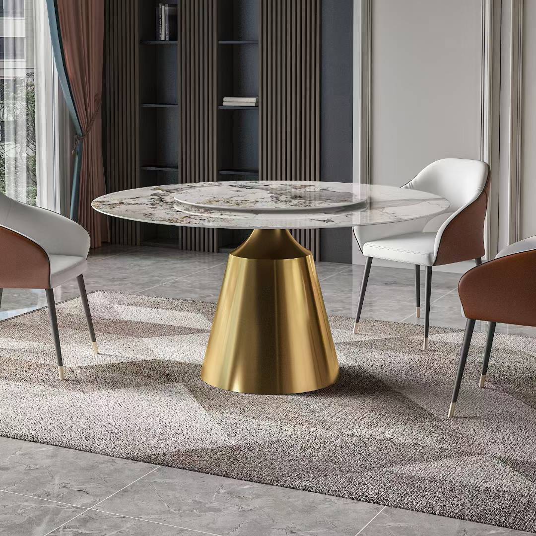 Dining table with marble top and gold base in a modern room setting