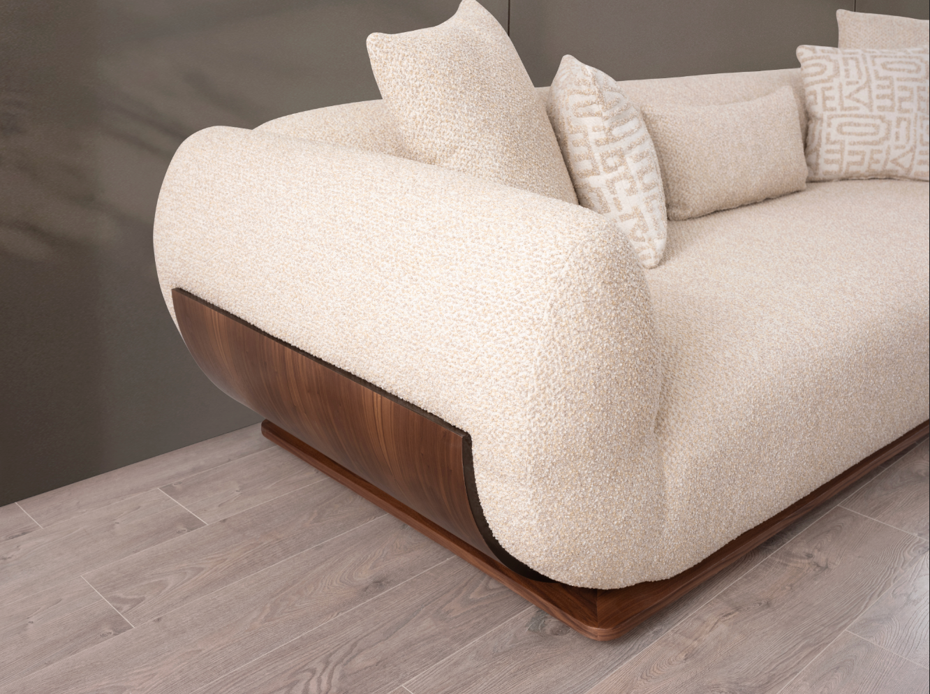 A close-up of a modern sofa with a textured cream bouclé seat and back, dark brown wooden side panels and base, and several cream throw pillows on a gray wall and light wood floor.