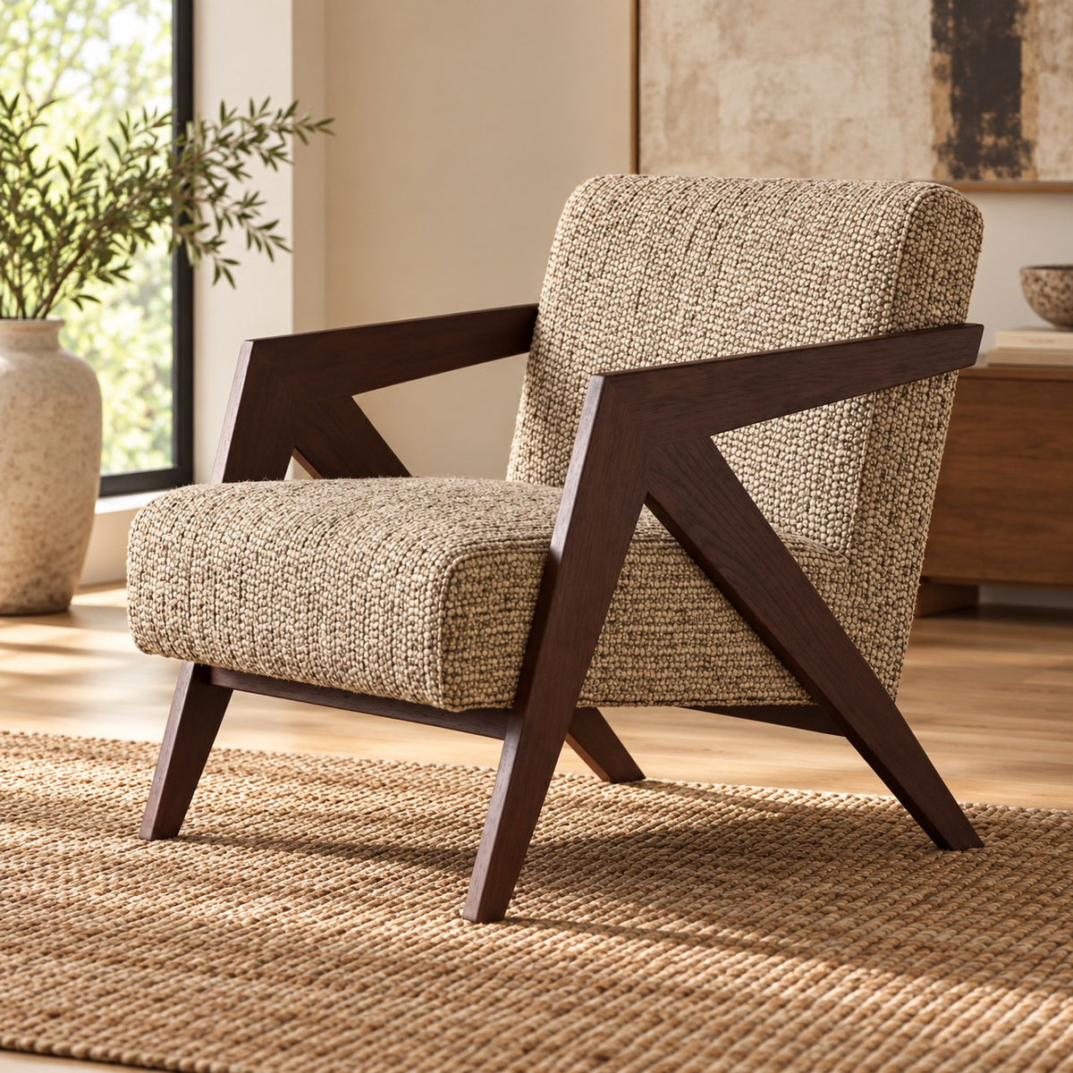 Beige textured accent chair with angular dark wood arms styled in a room.