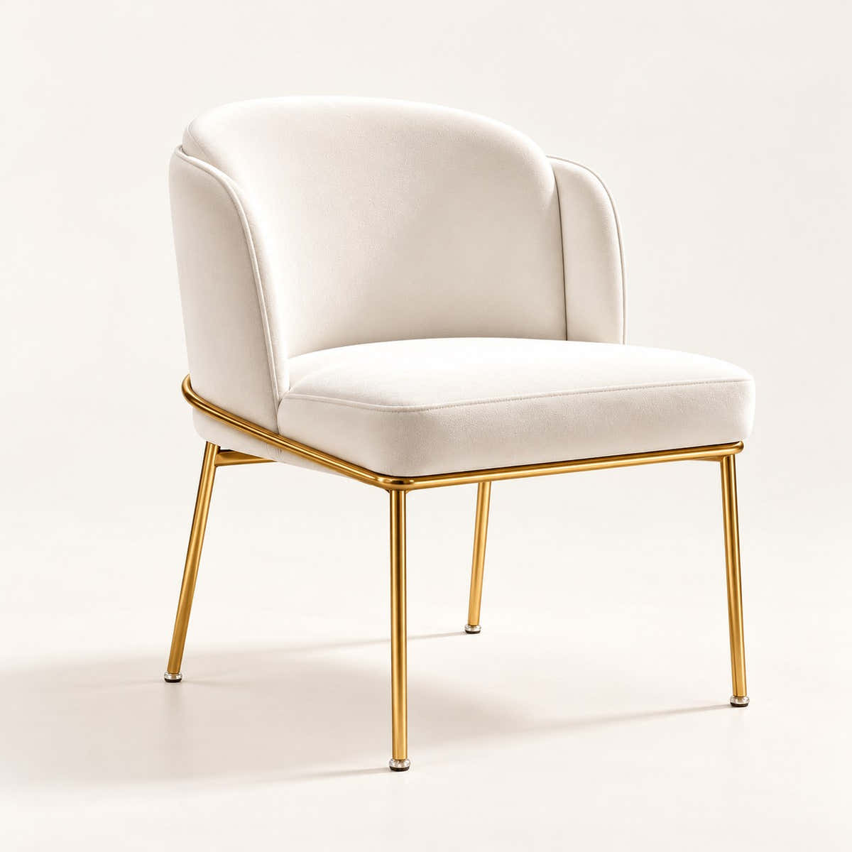 Off-white velvet dining chair with slim gold-tone frame on a neutral background.