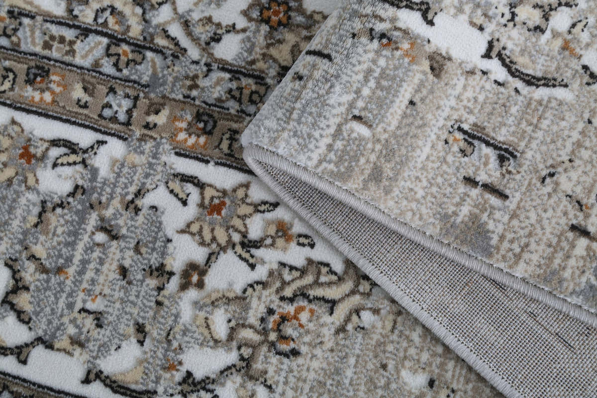 Afsana FF-10 original close-up showing floral pile, bound edge and backing