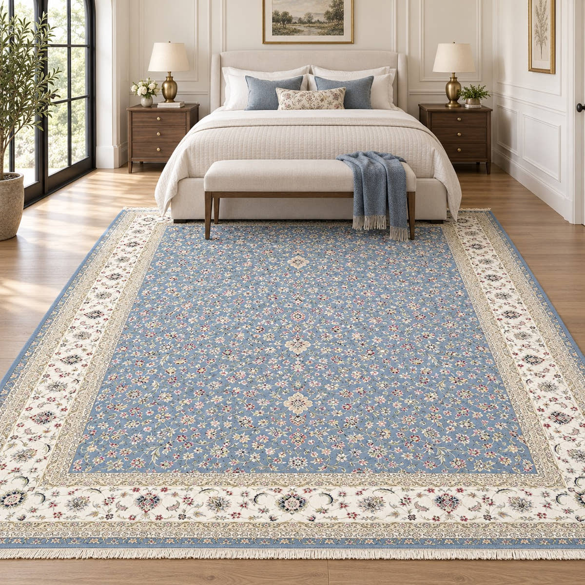 Golrokh blue 1500 reed Persian rug with an ivory floral border and fine ivory fringe in a digitally staged classic-modern bedroom