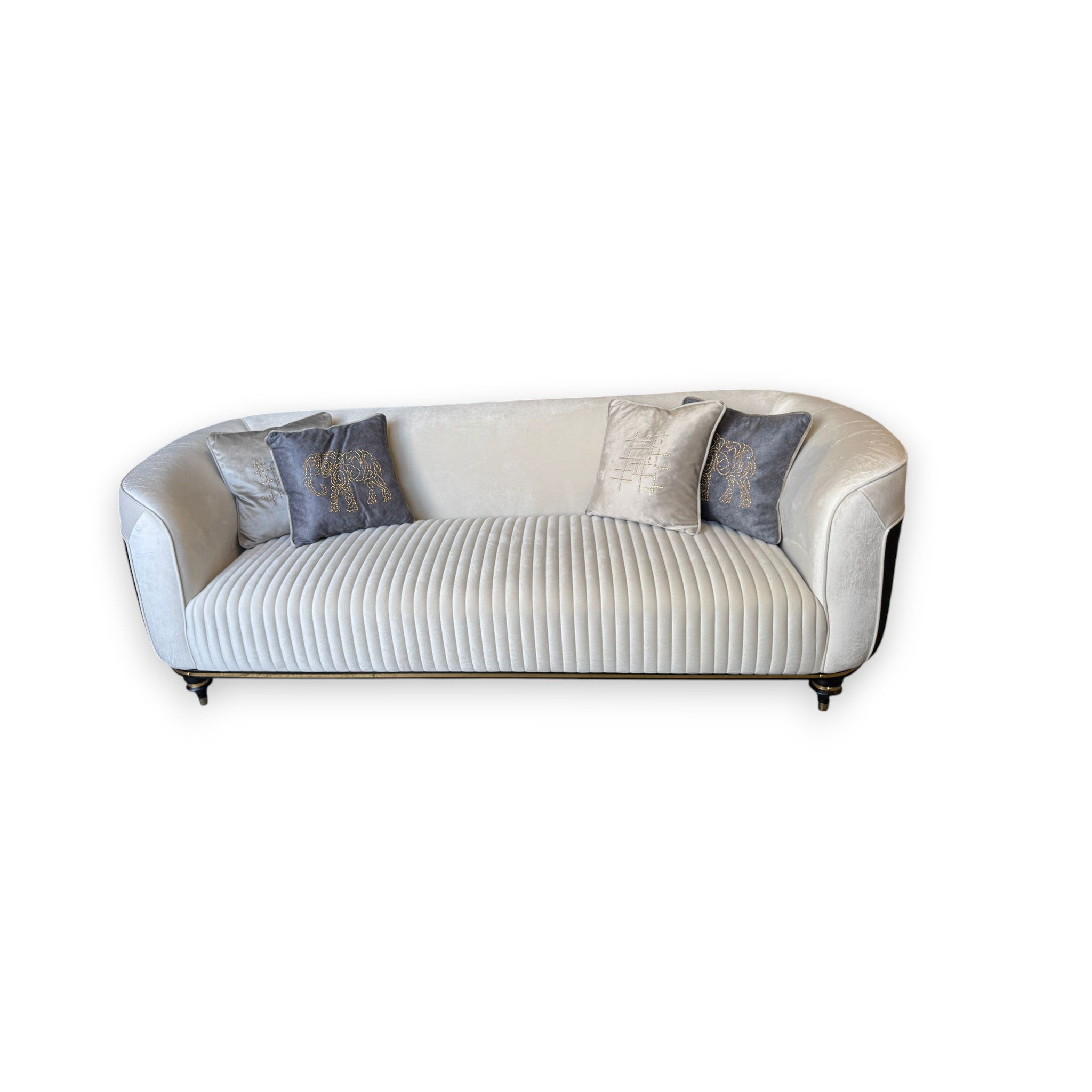 White sofa with decorative pillows on a white background
