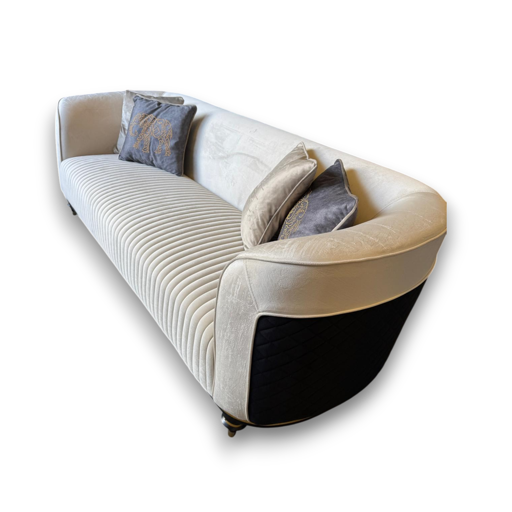 Modern sofa with decorative pillows on a white background
