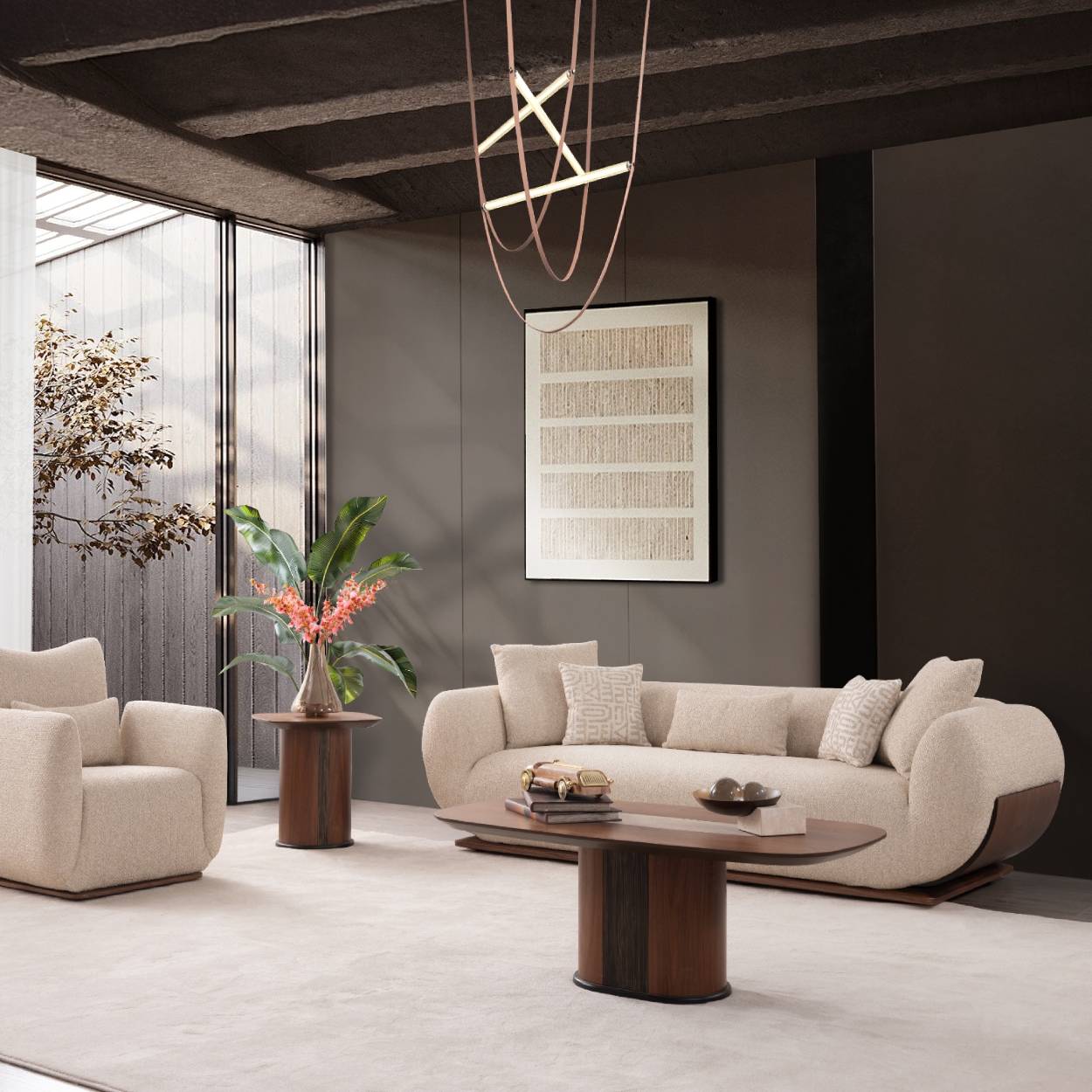 A modern living room featuring a curved cream-colored sofa as the main product, styled with matching throw pillows, a dark wood coffee table, a matching armchair, and a large framed art print on a dark gray wall.