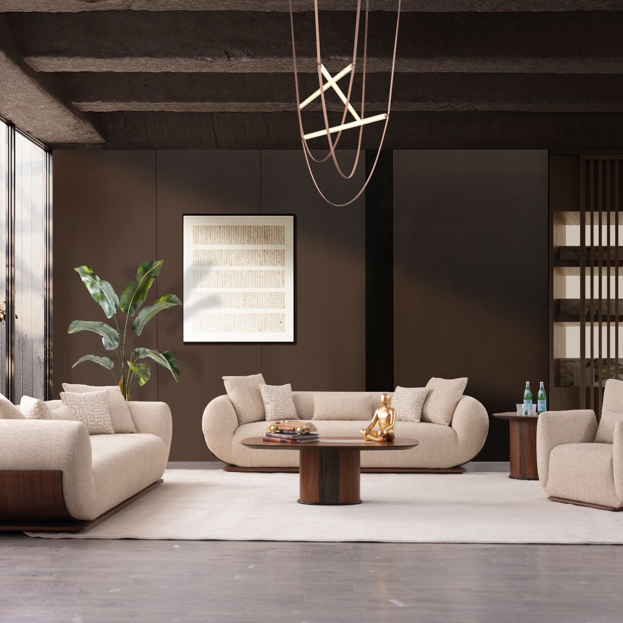 A modern living room featuring a cream-colored curved sofa as the central product, styled with matching throw pillows, a round wooden coffee table, a large white area rug, and a dark brown accent wall.