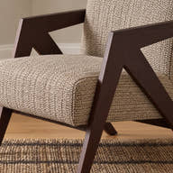 Beige upholstery texture and cushion seam.