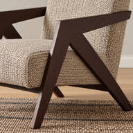 Angular dark wood arm and leg junction.