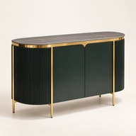 Dark fluted sideboard with gold-tone frame and dark top on a neutral background.