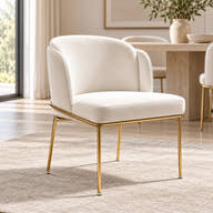 Off-white velvet dining chair with slim gold-tone frame styled in a room.