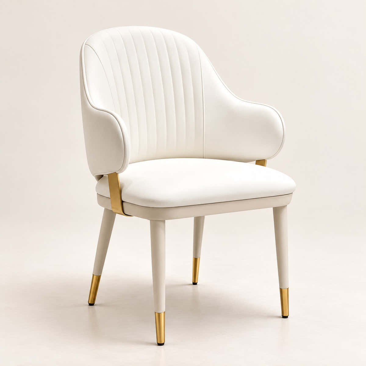 Off-white channel-back dining chair with gold-tipped legs on a neutral background.