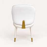 Upholstered seat edge and gold-tipped leg.