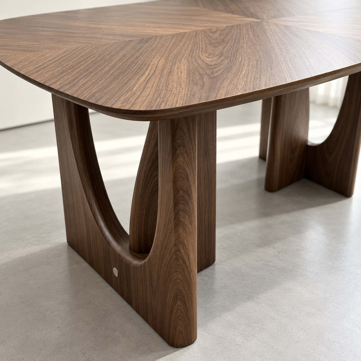 Sculptural support with curved open cutout.