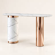 White veined marble console with asymmetrical rose-gold pedestal base on a neutral background.