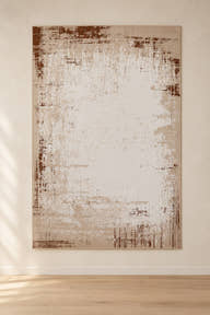 Sienna YC-08 ivory and caramel abstract rug shown upright in a digitally edited clean showroom