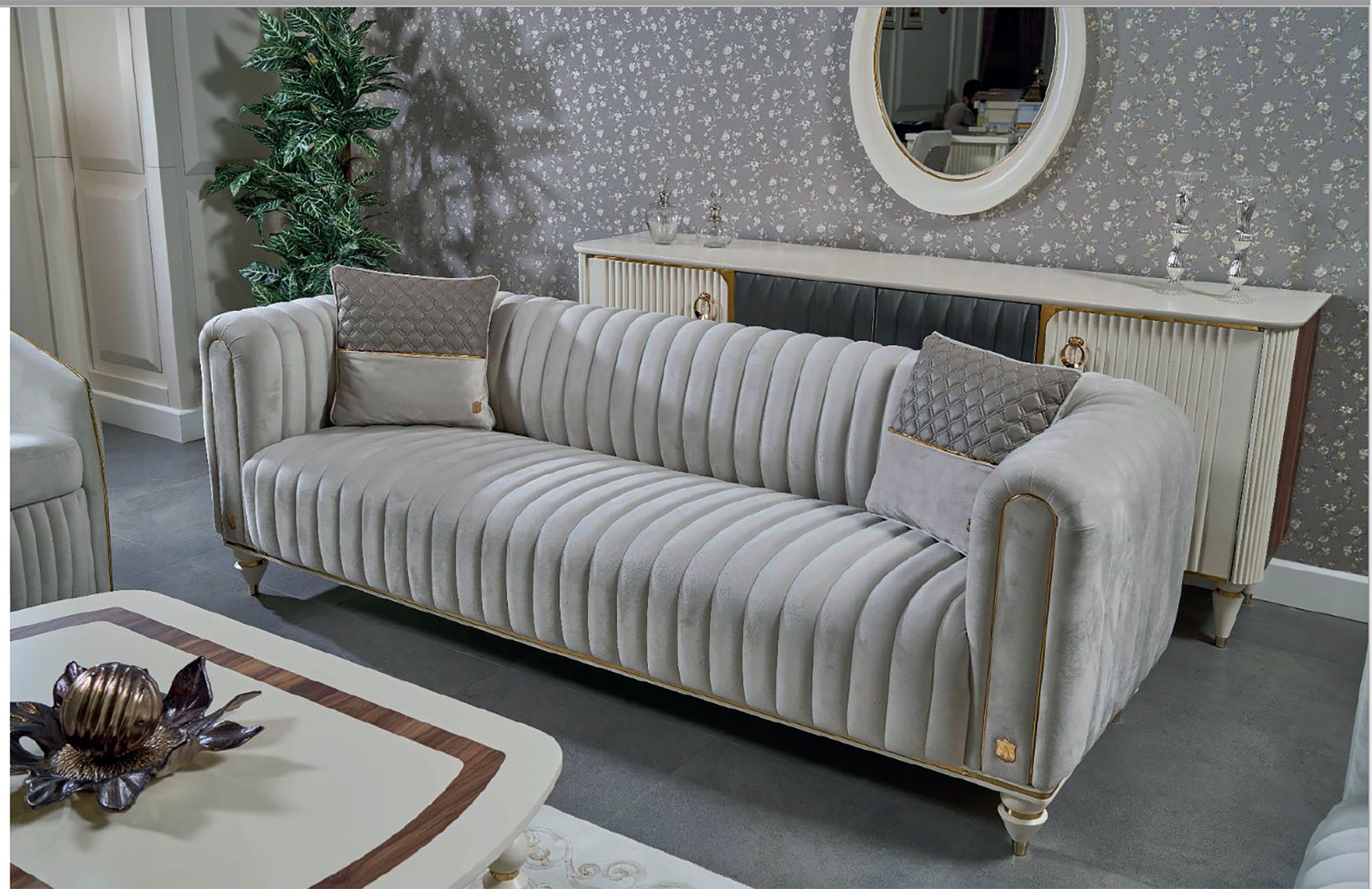 Gray velvet sofa in a room with decorative elements