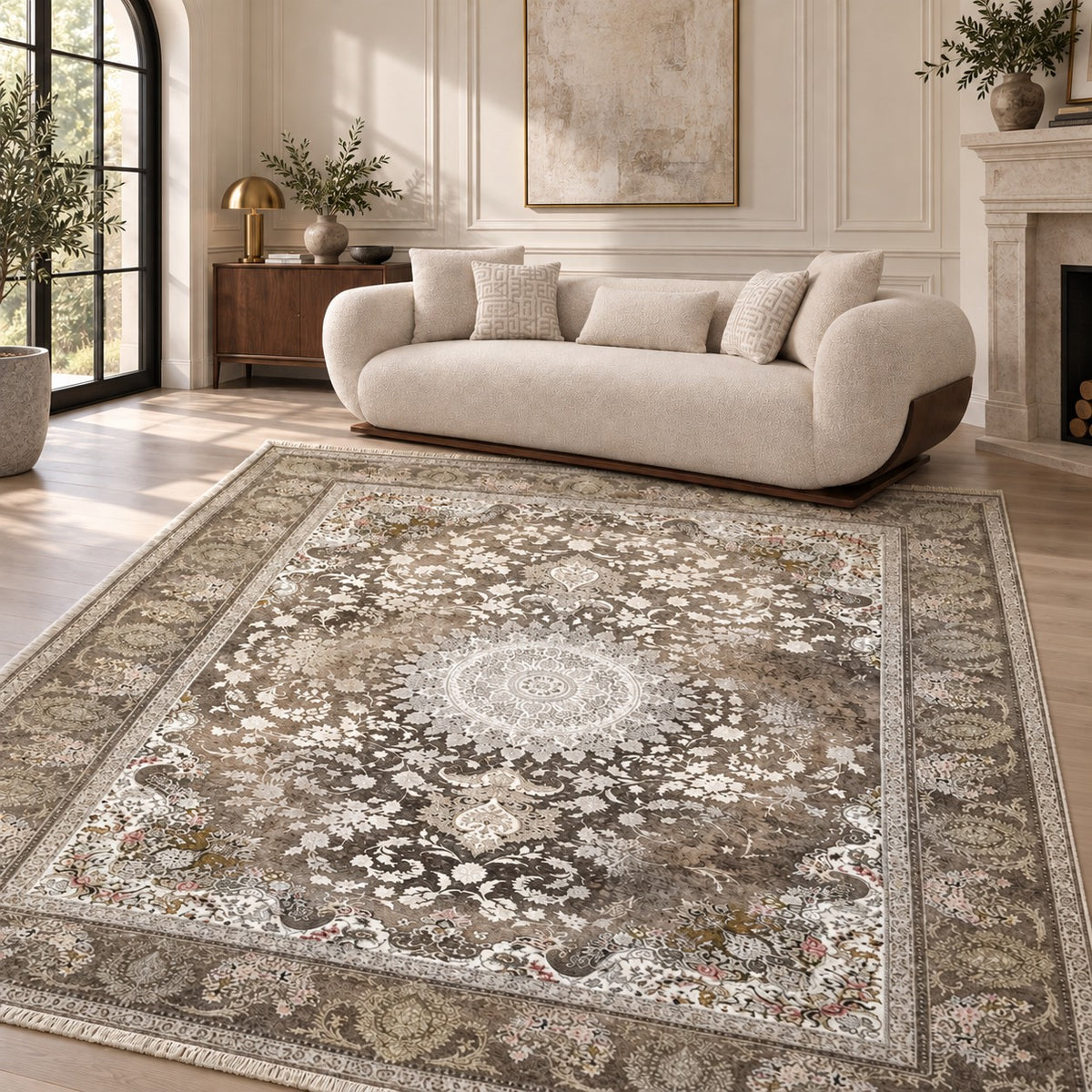Mahestan Vintage Persian rug with an ivory medallion and fine ivory fringe, styled with Glara Florida sofa in a digitally staged sitting room