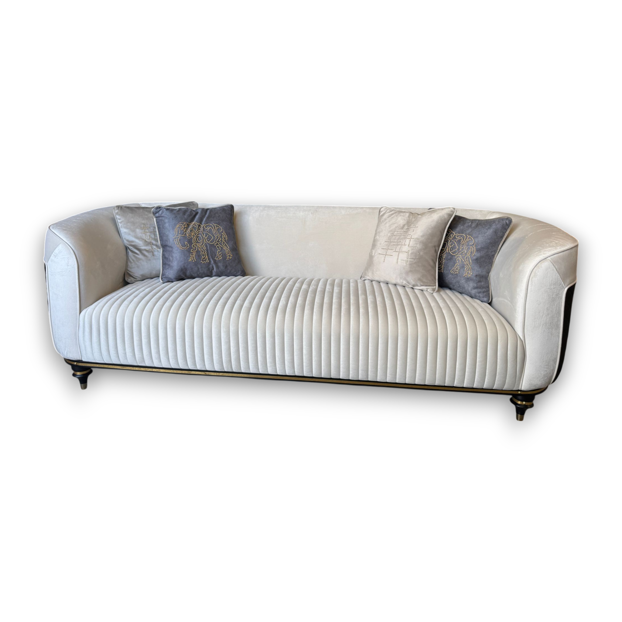 White sofa with decorative pillows on a white background
