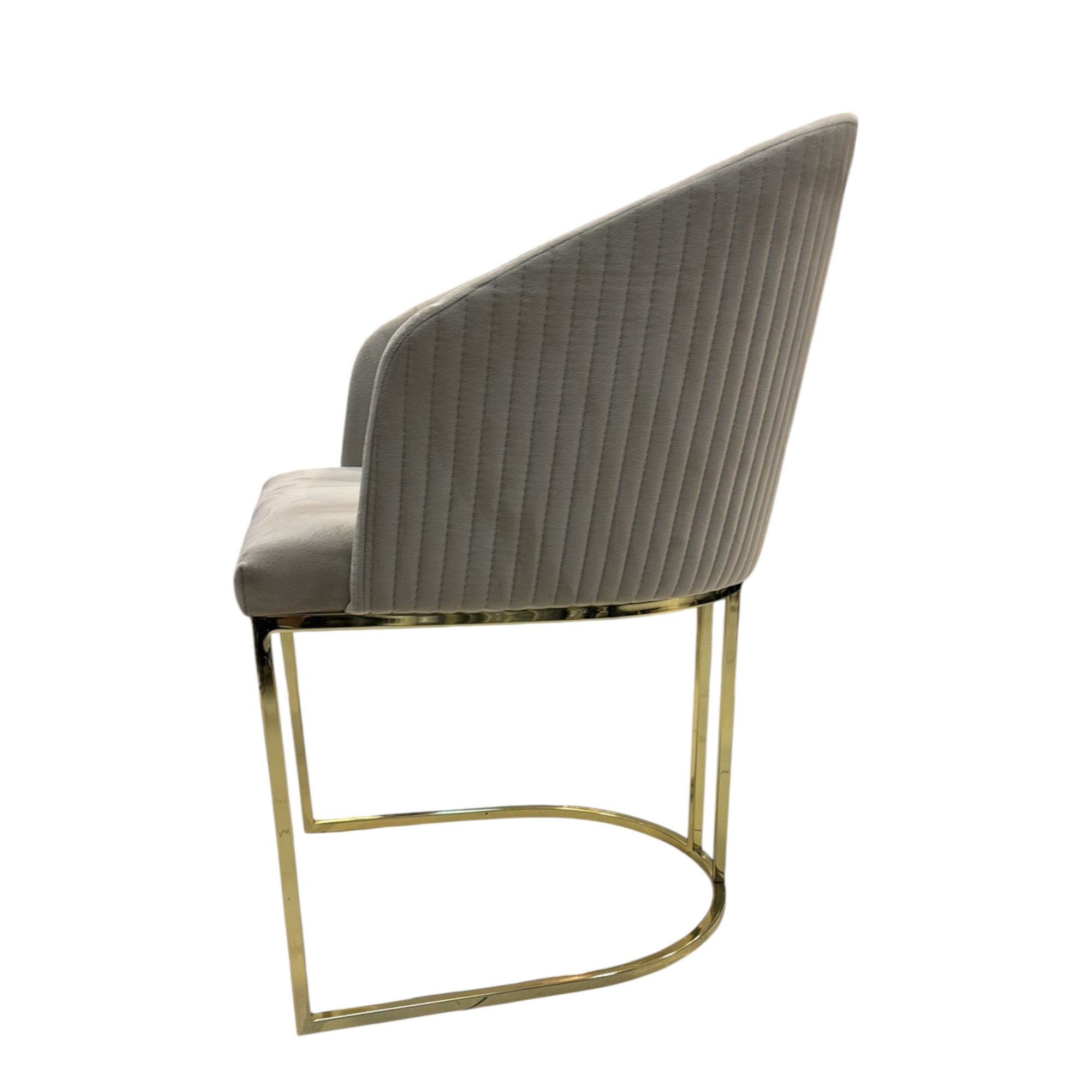 Modern chair with ribbed backrest and gold metal frame on a white background